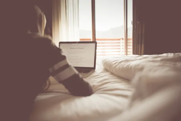 girl-reading-a-blog-in-a-bedroom-picjumbo-com.jpg