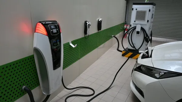 裕電