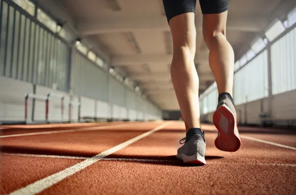 fit-athlete-during-training-on-running-track-37560