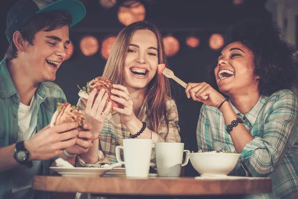 eating friends shutterstock